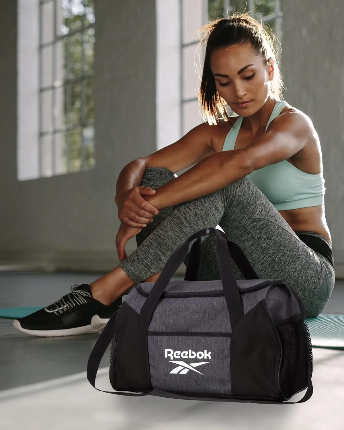 Reebok Duffle Bag  Gym Bag for Women & Men, Carry On and Overnight Duffle for Travel & Fitness, Size Small, Aleph Grey