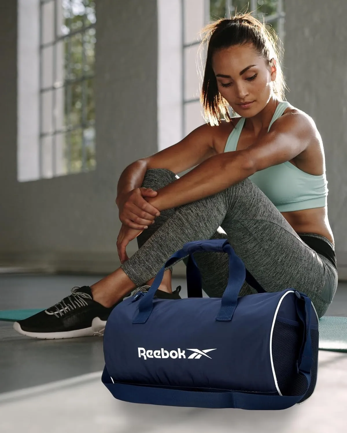 Reebok Duffle Bag  Gym Bag for Women & Men, Carry On and Overnight Duffle for Travel & Fitness, Size Small, Kellan II Blue
